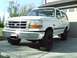 1996 Ford Bronco - This white Ford Bronco is shown from a three-quarter front angle.