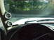1996 Ford Bronco - Aftermarket gauges are mounted on the A-pillar inside the vehicle's cabin.