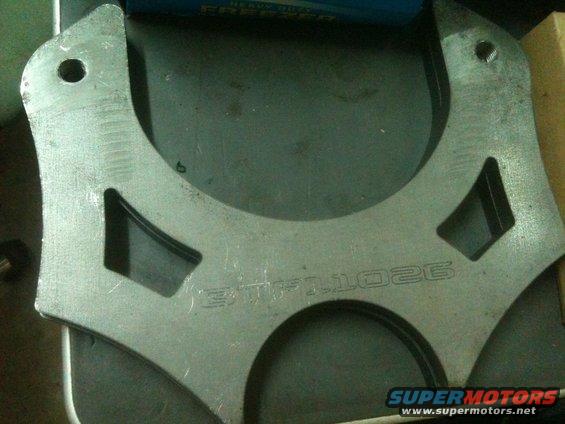metal bracket with 'BTF-1026' etched into it