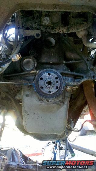 Engine transmission connection with bolts and oil pan