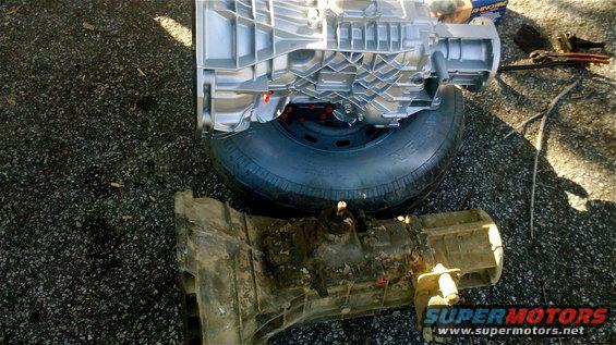 Clean and dirty transmissions side-by-side on asphalt