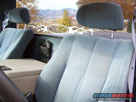 1993 Ford F-150 interior with light blue seats and a decal on the rear window