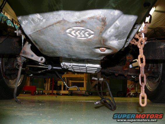 Underside of vehicle showing oil pan and chain