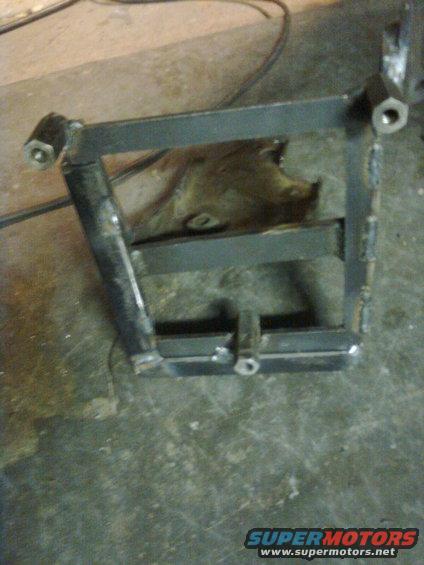 Welded metal bracket with bolt holes, possibly for automotive use