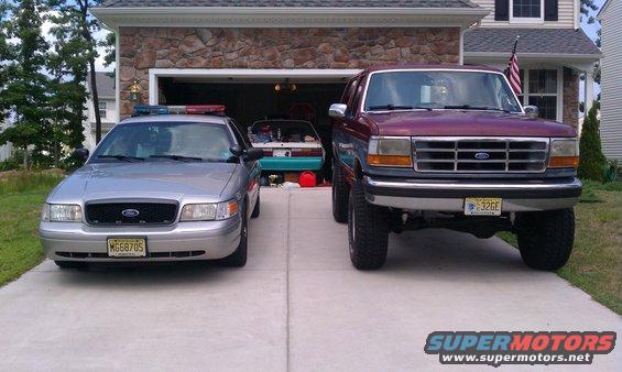 imag0350.jpg Daily Driver (CVPI) and the Bronco 

82 Fox coupe sitting in the garage awaiting restoration 