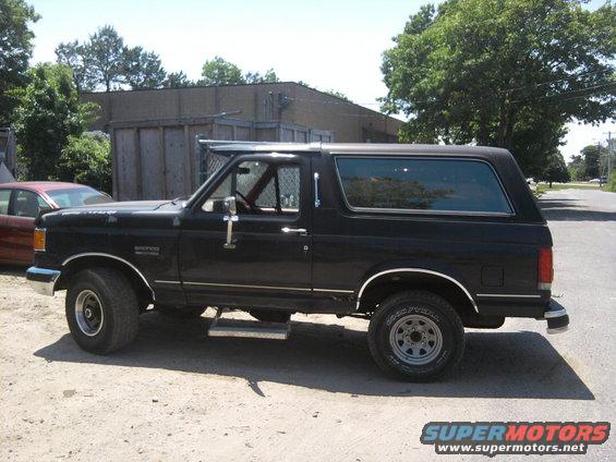 Black 1989 Ford Bronco parked outside