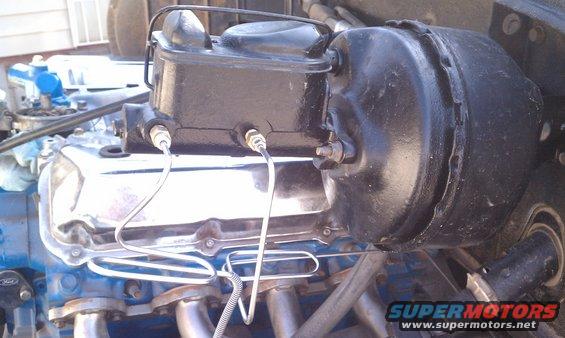 Brake booster and master cylinder assembly on engine