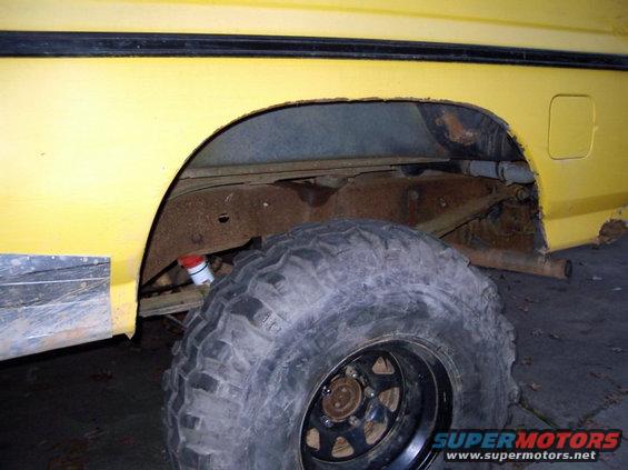 Good shot of cut rear fender and patch panel.  The body had separated and was flapping making noise.