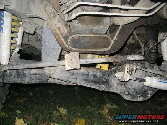Undercarriage of a vehicle with visible suspension components, leaf springs, and a differential. BDS shocks are present