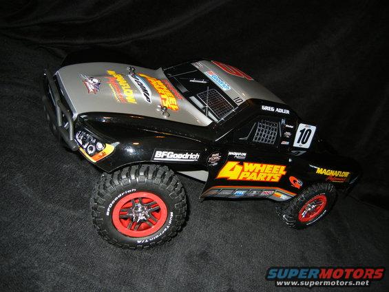 RC trophy truck with '4 Wheel Parts' decals and number 10