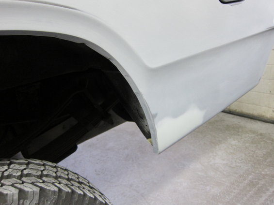 1987 Dodge 1500 rear fender and tire, showing bodywork prep