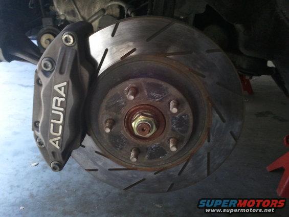 Acura brake caliper and slotted rotor
