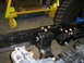 1992 Ford Bronco - The image shows a close-up view of a vehicle's frame and suspension system, with a large tire in the background.