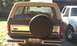 1984 Ford Bronco - The rear of a Ford Bronco, showing its spare tire and a Washington license plate.