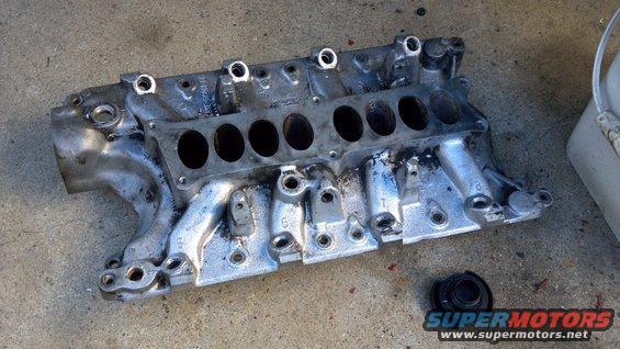 20111102_170812_691.jpg wire wheeled the gaskets off and pressure washed it. Gotta clean the rest of the gunk off, but it looks 100 x better already