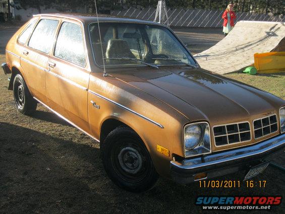 Brown hatchback with chrome trim and a prominent grille