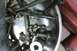 2005 GMC Yukon - A collection of bolts and ball bearings are shown in a metal bowl, likely during a mechanical repair or rebuild process.