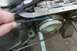 2005 GMC Yukon - Mechanic uses a blue tool to work on a transmission component during a rebuild.