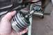 2005 GMC Yukon - A person holds a disassembled transmission part, likely for repair or inspection.