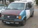 1992 GMC Safari - This van has been repainted with several different colors on its body panels.