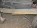 1992 GMC Safari - Underside view of a vehicle's leaf spring and fuel tank, showing suspension components.