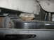 1992 GMC Safari - Close-up view of the undercarriage shows a suspension mount with a rubber isolator and metal brackets.