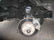 1992 GMC Safari - Close-up view of the front suspension and brake assembly, showing the rotor and caliper.