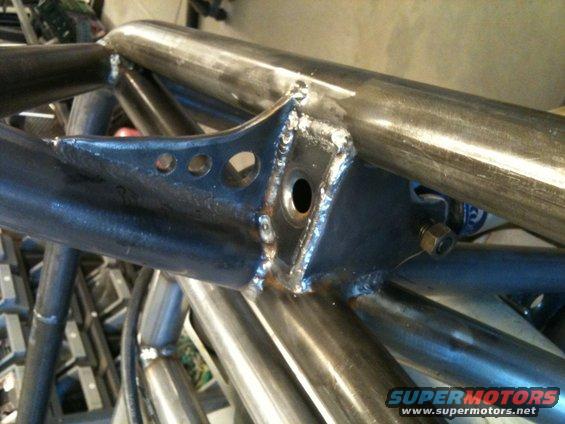 Welded metal tubing frame with a bracket and bolt