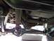 1989 Ford Bronco - Undercarriage view showing the rear axle, driveshaft, and suspension components.