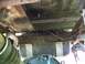 1989 Ford Bronco - Undercarriage view showing fuel tank and suspension parts.