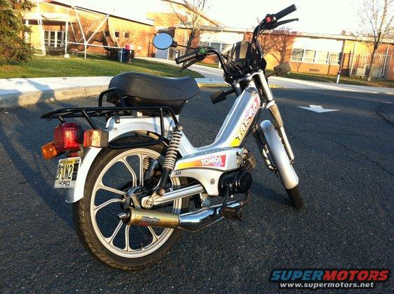 Tomos moped with a rear rack and aftermarket exhaust