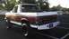 1989 Ford Bronco - This lifted Ford Bronco has a two-tone paint scheme and is parked in a lot.