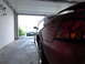 2003 Mercury Marauder - Two cars in a garage, one red sports car and a black Audi sedan.