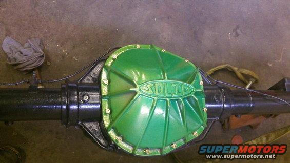 Green "SOLID" differential cover on a black rear axle assembly