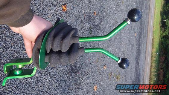 Dual green stick shift levers with black knobs