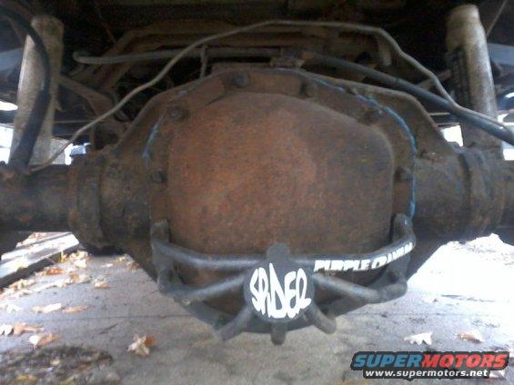 Rusty differential housing with a black protective cover labeled 'SPIDER' and 'PURPLE CRAN'