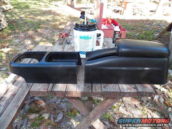 Cutting the Ford SVT console in half b/c my giant water mug will not fit into it.  I am going to use the front portions only with a bigger part for the back.