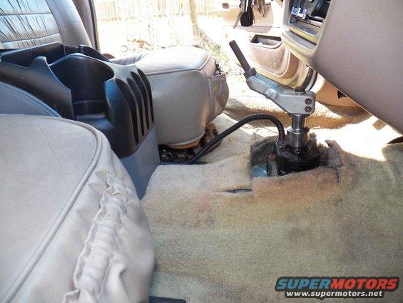 The front portion will cover that naked shifter.