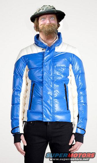 Man wearing a blue and white puffer jacket, black pants, and a camouflage hat with a beard