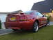 2003 Mercury Marauder - Rear view of a red 2003 Ford Mustang GT with a spoiler and GT badging.