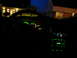 2003 Mercury Marauder - The illuminated interior dashboard and radio display are visible at night, with a house in the background.