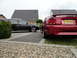 2003 Mercury Marauder - Two cars, a red Ford Mustang GT and a black Audi wagon, are parked in a driveway.