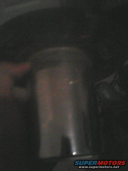 Close-up of a cylindrical engine part, possibly a filter or canister