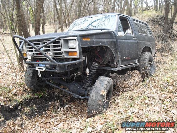 Black off-road SUV with brush guard and lifted suspension