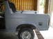 1988 Ford Bronco - This vehicle's body is undergoing preparation, with primer applied to the rear section and a visible tire.