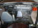1988 Ford Bronco - Interior view of a disassembled 1992 Ford F-Series truck or Bronco, with seats and dashboard visible.