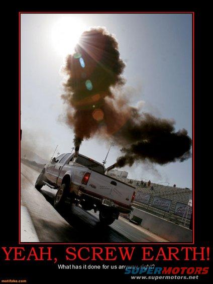 Pickup truck on a drag strip with dual exhaust stacks emitting large amounts of black smoke