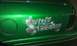 2002 Ford Crown Victoria - Custom lettering on the side of a green vehicle, with a dollar sign graphic.
