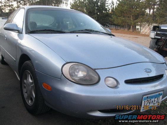 Light blue sedan front view with a Minnesota license plate