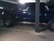 2008 Nissan Titan - Side view of a dark blue pickup truck, identified as a 2008 Nissan Titan.